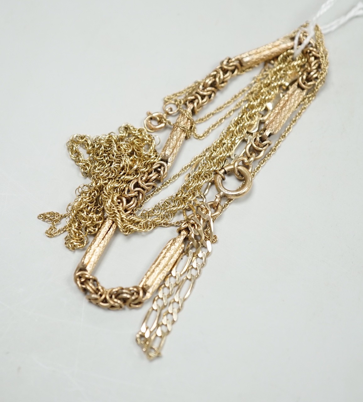 A 9ct gold necklace, 45cm, a 9k fine link necklace and two 9ct gold bracelets, 17 grams.